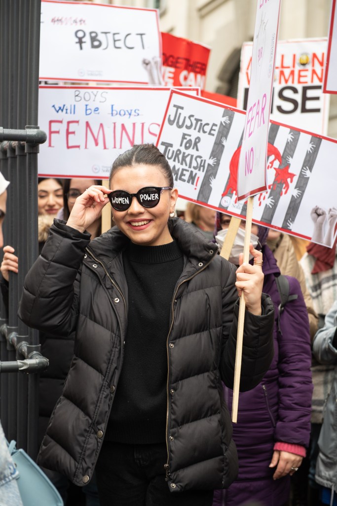 Young woman in sunglasses during the Million Women Rise demonstration in London