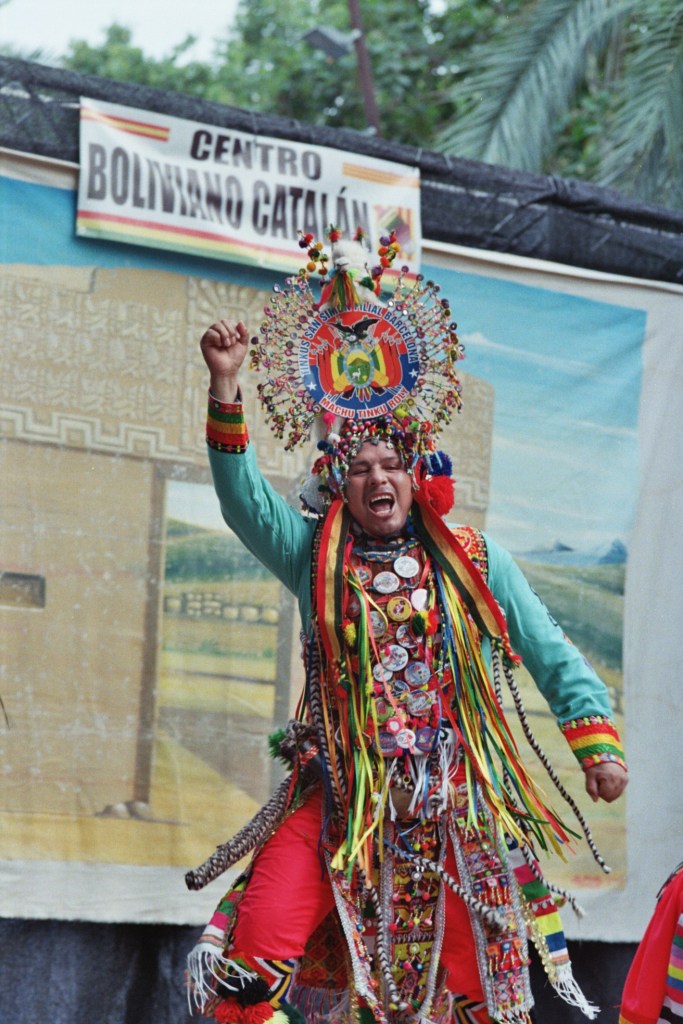 Performer in decorative costume dancing in street festival in Barcelona, Spain 