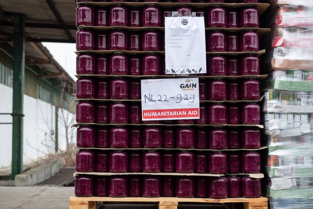 Jars of food stacked on pallet in lorry headed for Ukraine. 