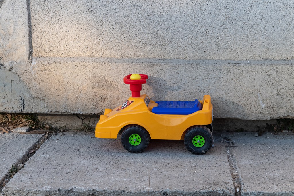 Child's toy truck outside Freedom House, a refugee centre 